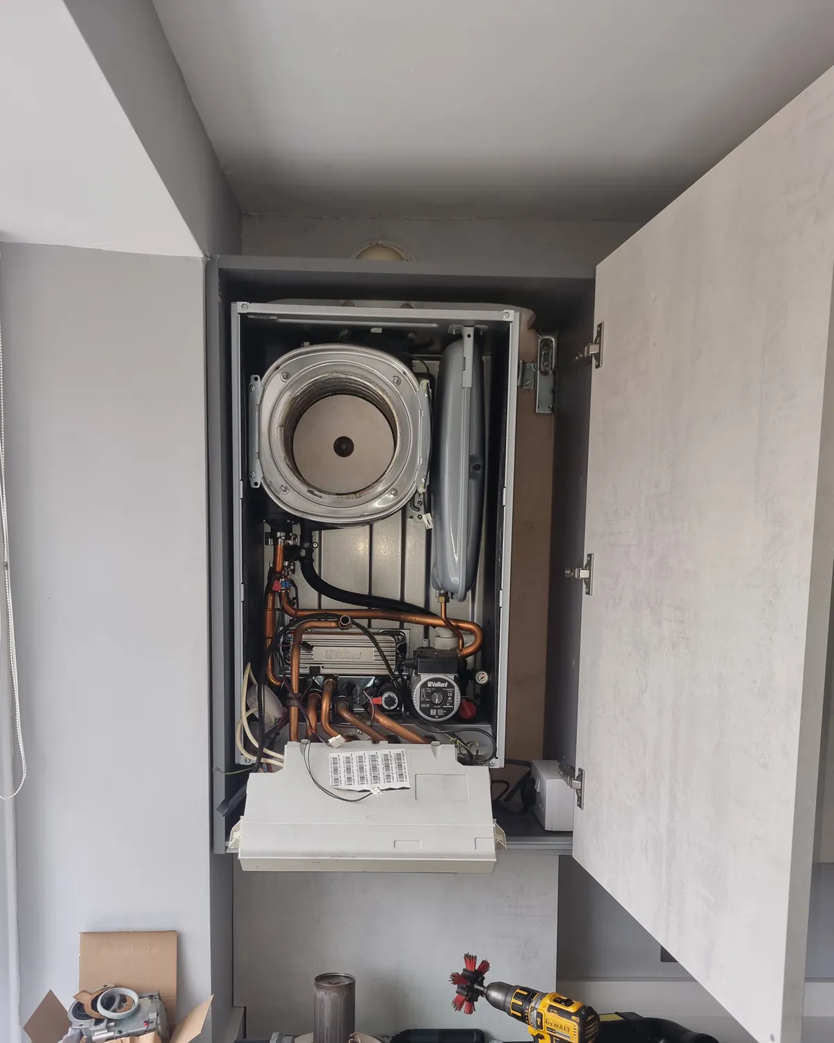 Gas boiler with its casing removed for diagnosis and repair