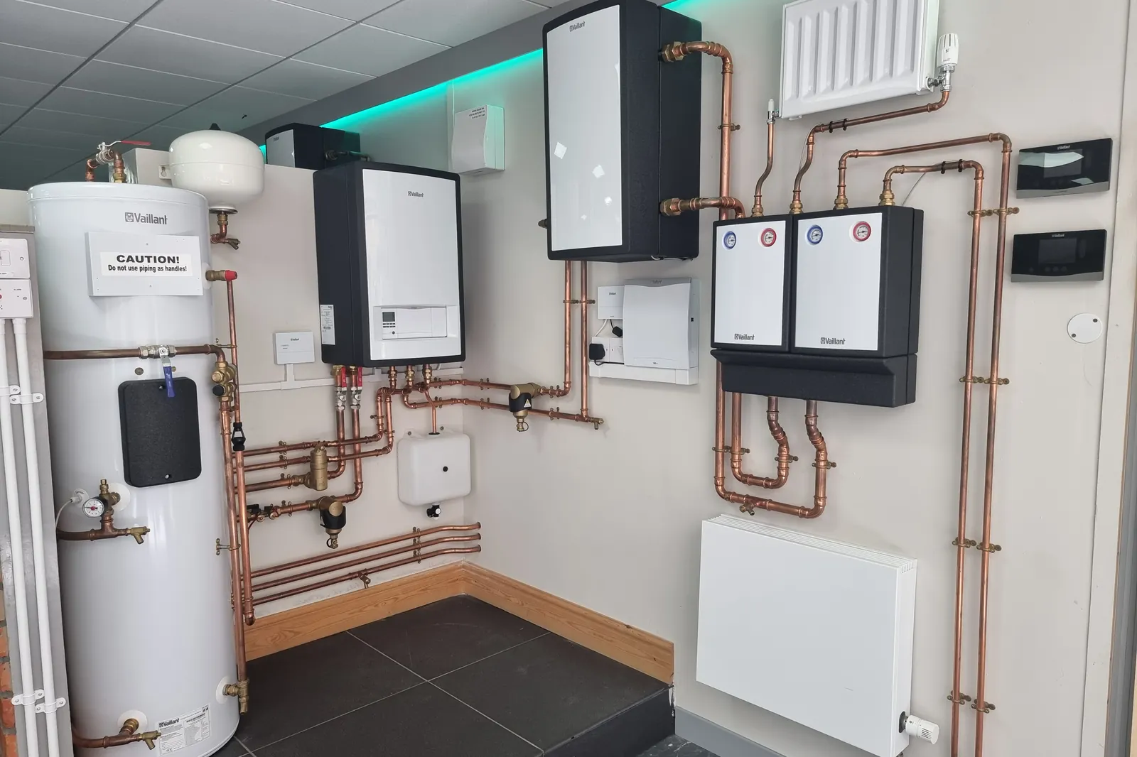 Heat pump cylinder, controls and copper pipework laid out as a complete system