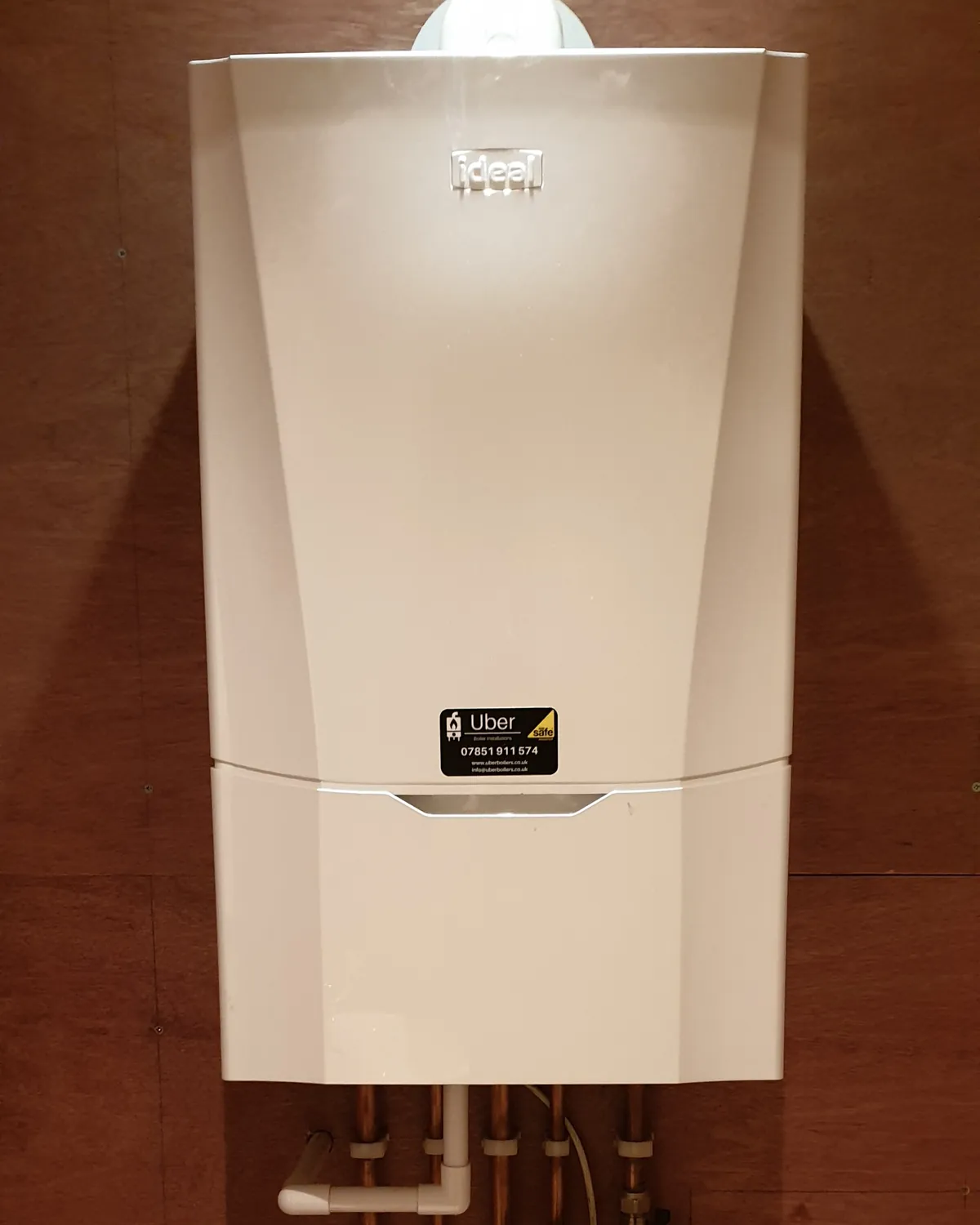 Newly installed Ideal combi boiler with tidy pipework