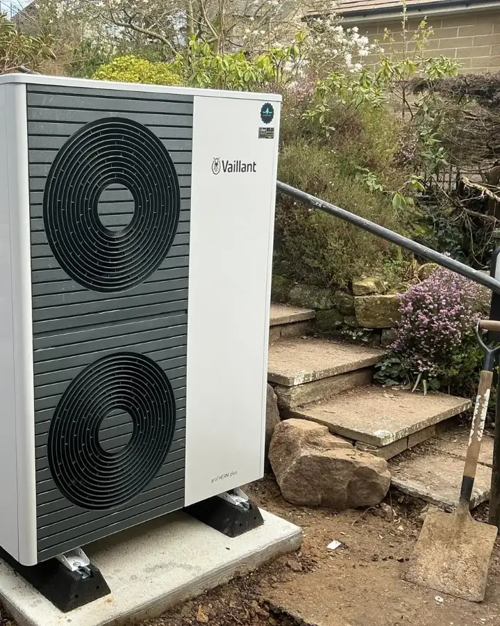 Vaillant air source heat pump installed beside garden steps