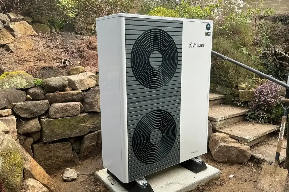 Vaillant air source heat pump on a new concrete base in a back garden